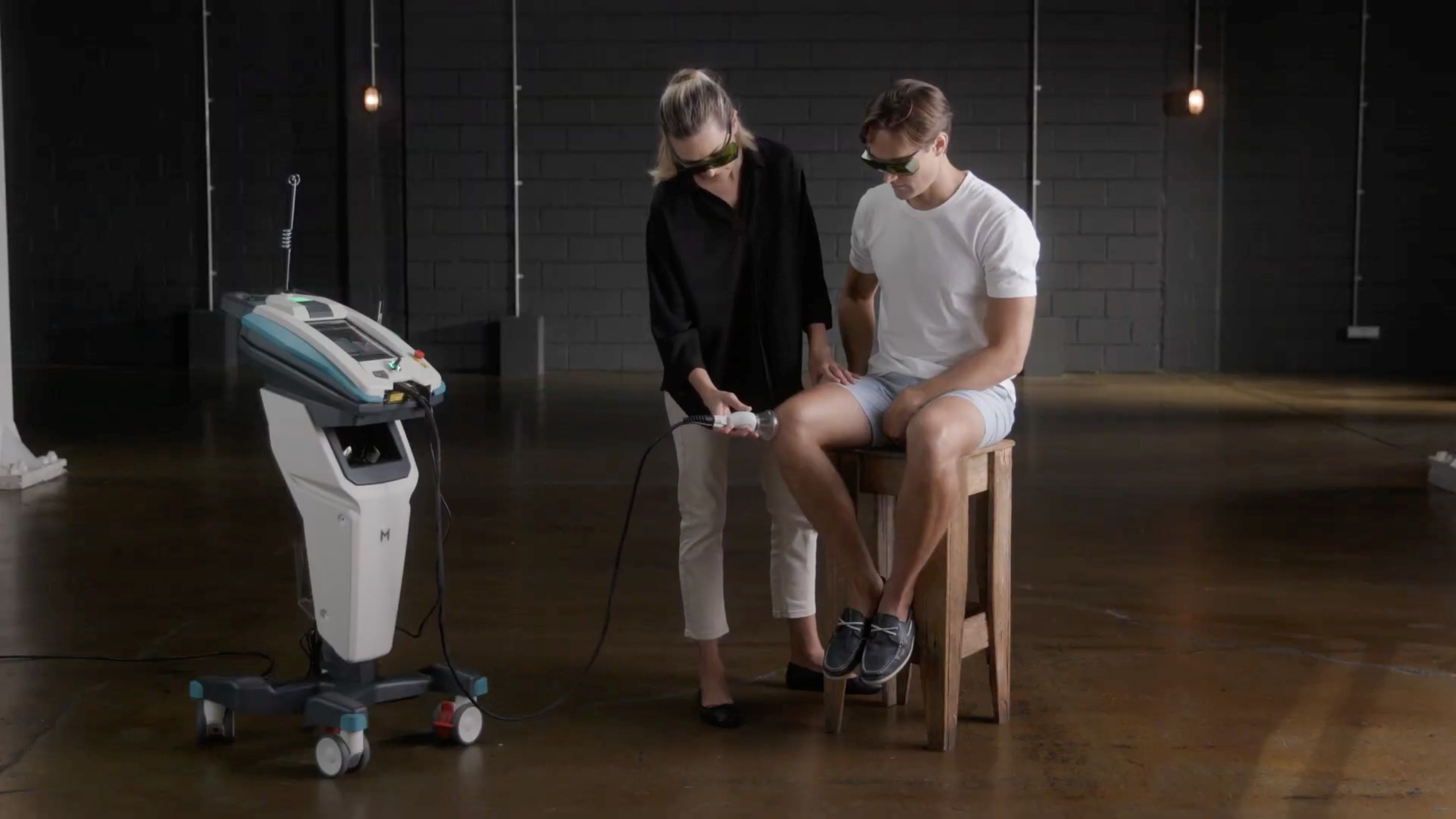 Chiropractor delivering MLS laser therapy for back and spine conditions